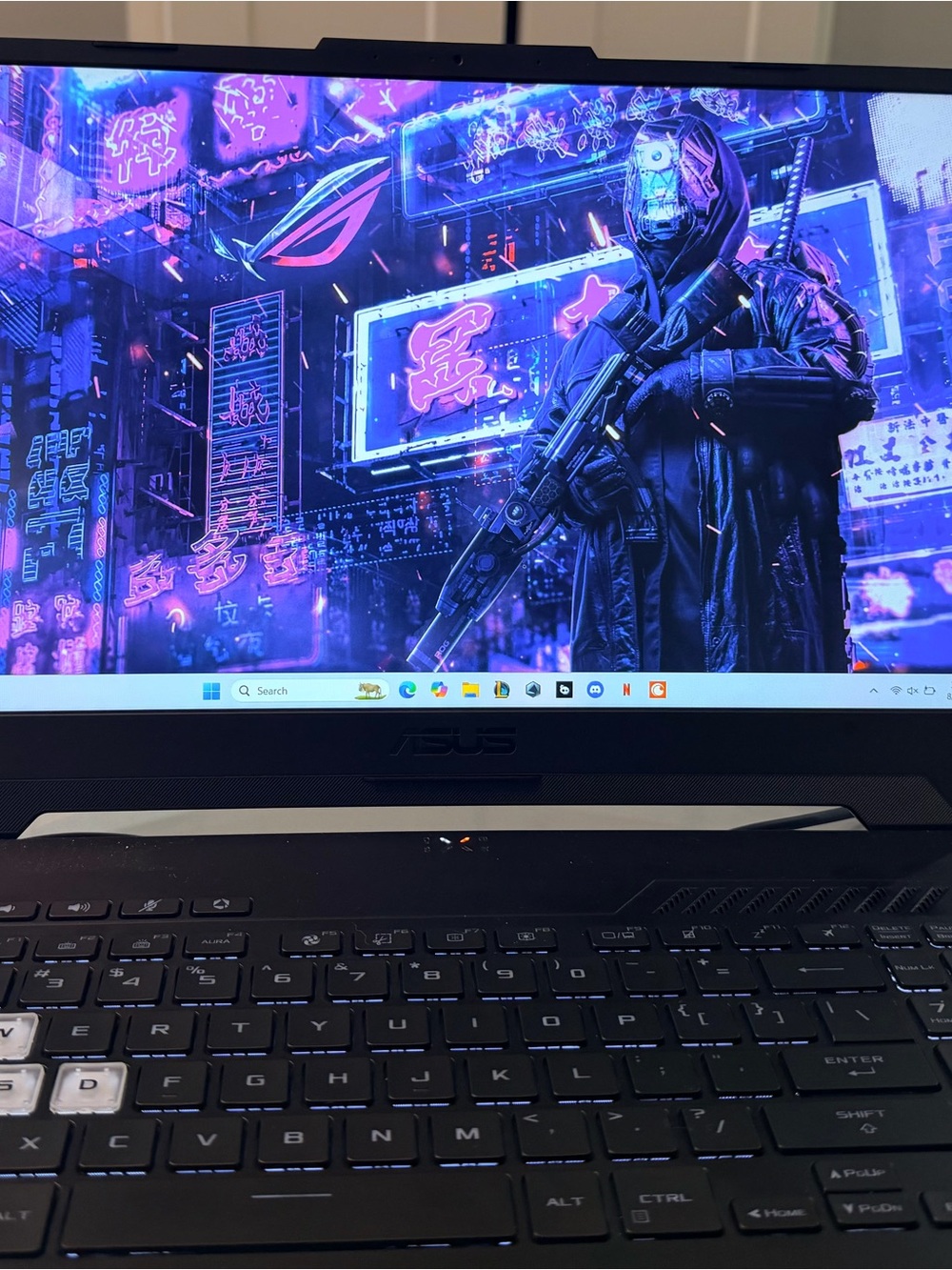 ASUS Black Gaming Laptop with Cyberpunk Display